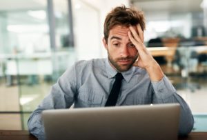 Business man with hand on head frustrated about his backup disaster recovery (BDR) plan 