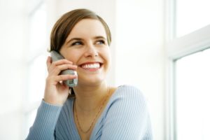 Woman using internet based phone services 