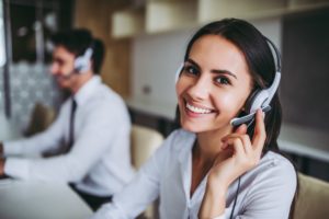 Call center workers using a cloud-based phone system or VoIP Phone System