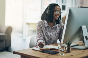 IT Help Desk Support - woman on a phone at her desk