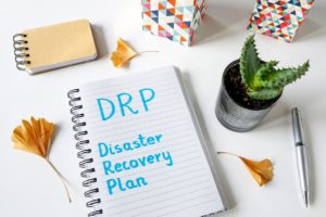 DRP Disaster Recovery Plan written in a notebook 