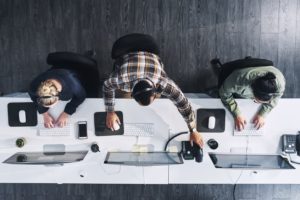 High angle shot of a group of outsourced IT agents working in an office 