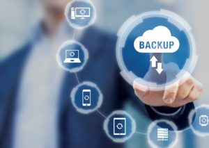 Backup files and data on internet with cloud storage technology that sync all online devices and computers with network connection, protection against loss, business person touch screen icon 