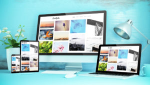 blue responsive desktop with devices showing responsive portfolio website 3d rendering
