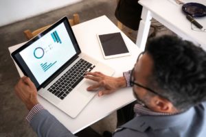 High angle view of a businessman generating a report 