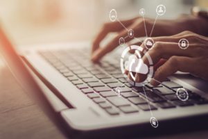 ): Businessman working on his laptop showing management of company data using cloud backup - concept of disaster recovery strategies