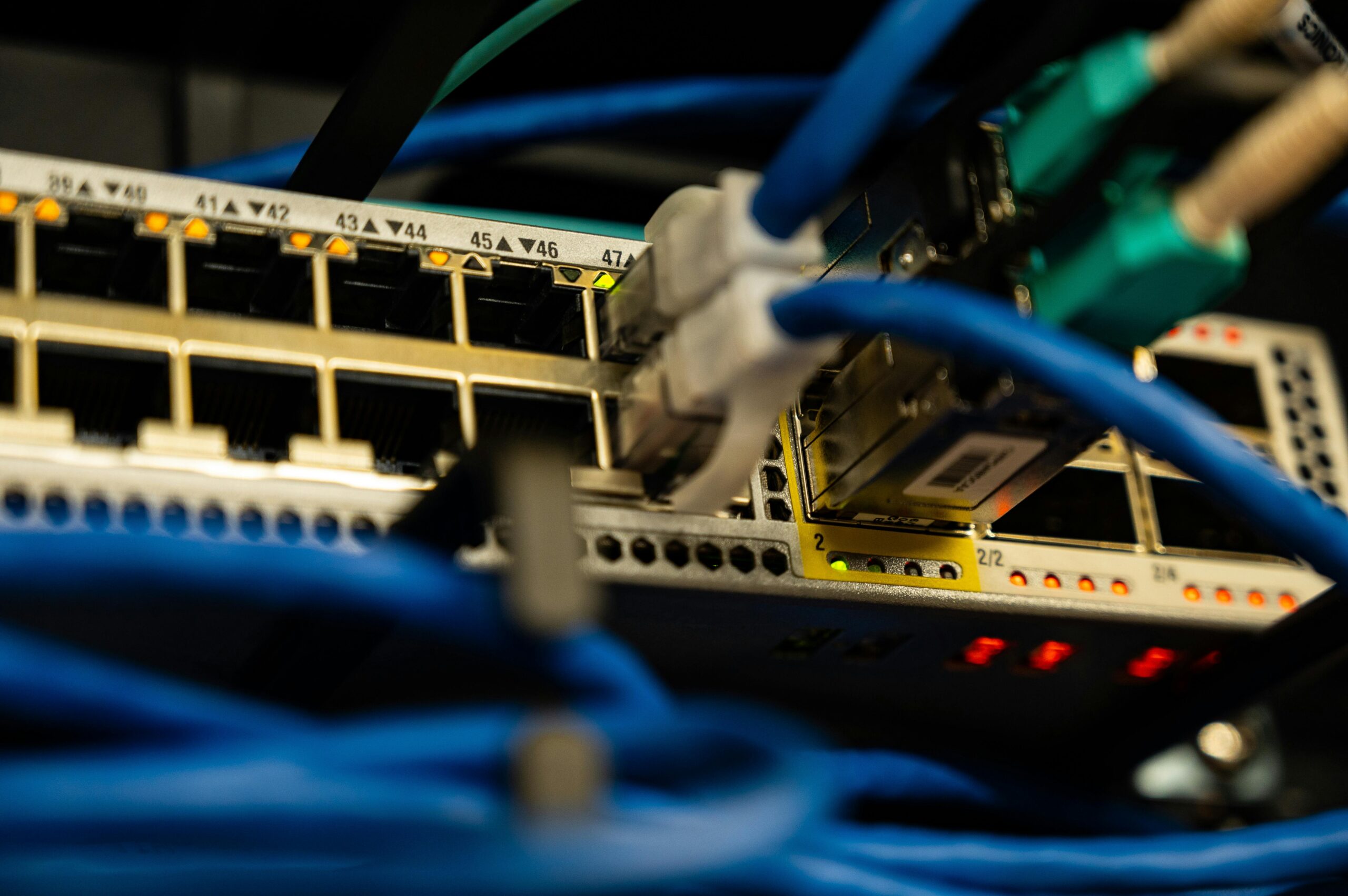 Close-up of network switch with plugged-in Ethernet cables